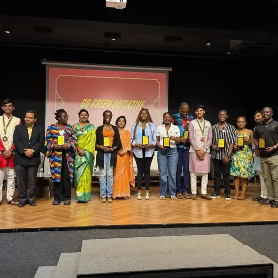 Exchange participants and hosts gathered on stage during a presentation