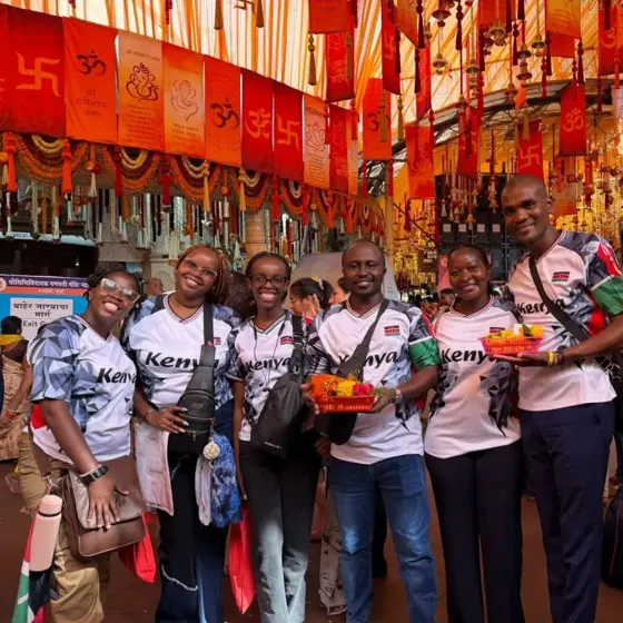 The Kenyan delegation together beneath decorations during Ganpati celebrations