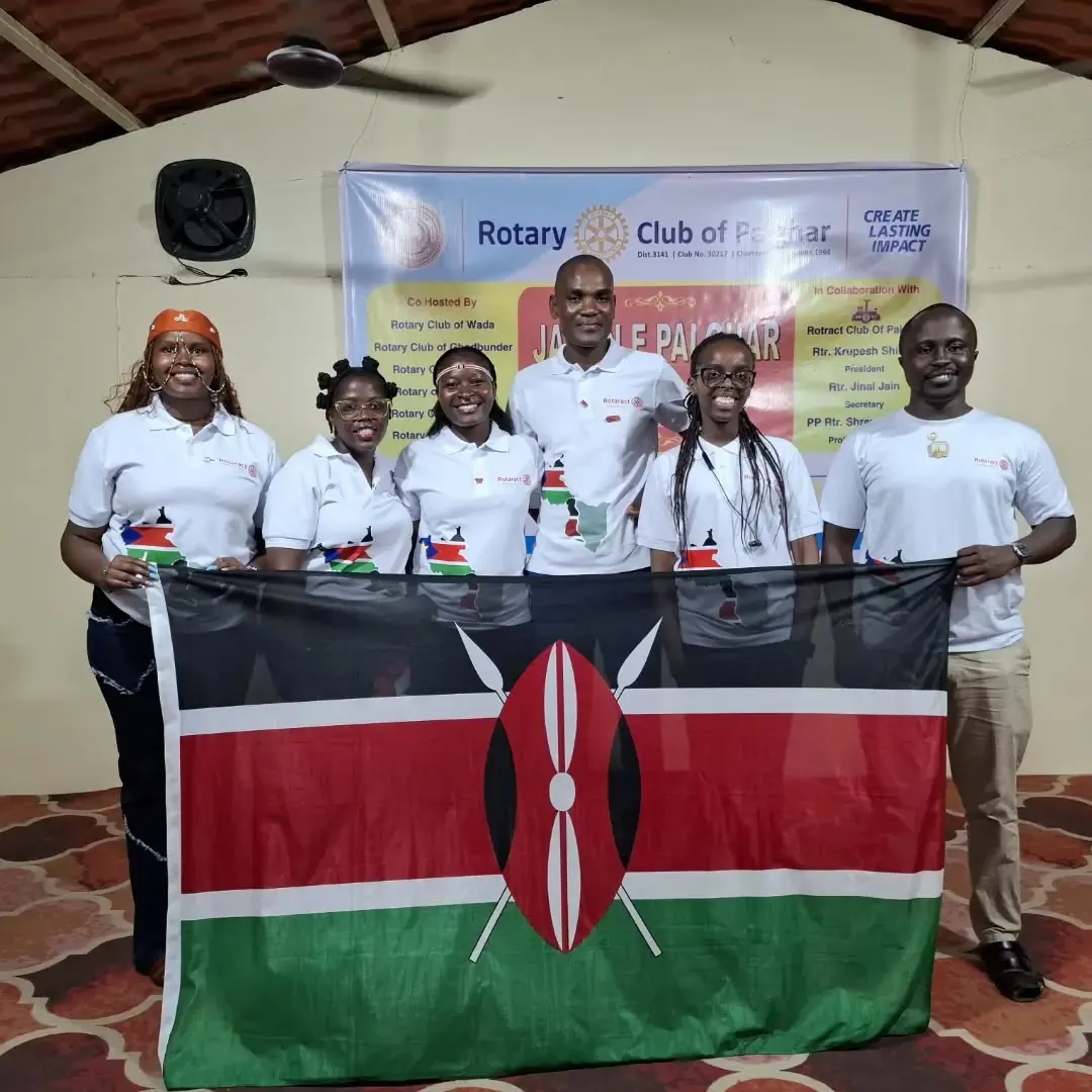The six Kenyan delegates hold the national flag at a Rotary gathering in Palghar