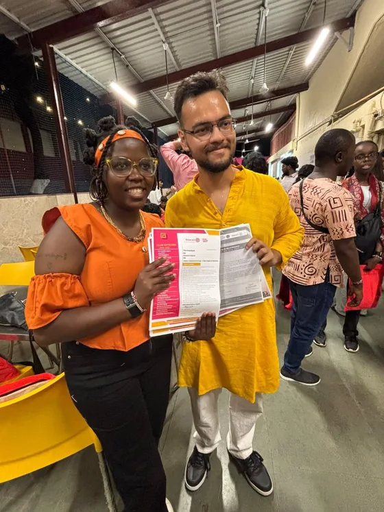 Club presidents displaying exchanged official letterheads during the India visit