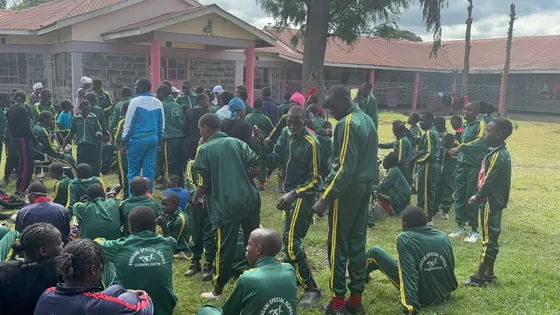 The group gathered on the school field