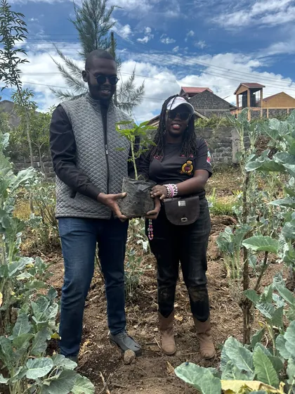 Members holding seedlings ready to plant