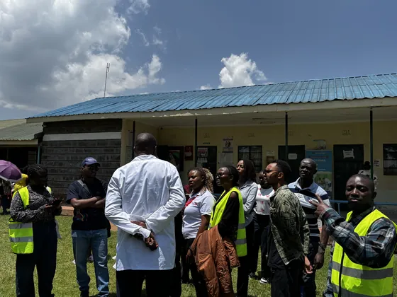 Members and hospital staff gathering outside the clinic