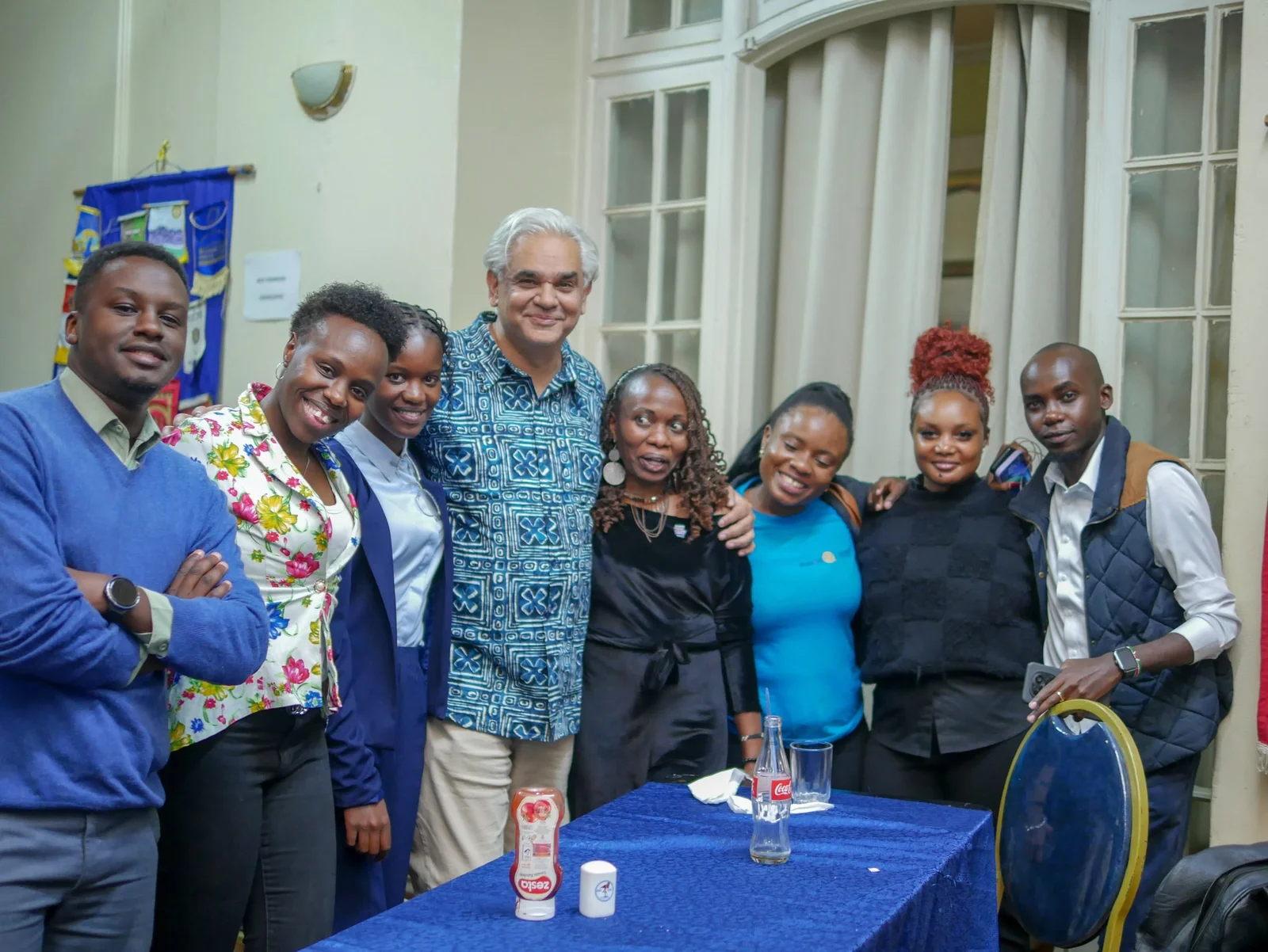 Rotaractors gathered with the District Governor during the Nakuru Region meeting