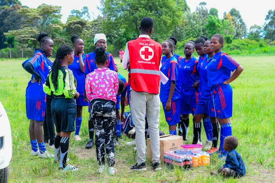 Young participants and volunteers together on the playing field